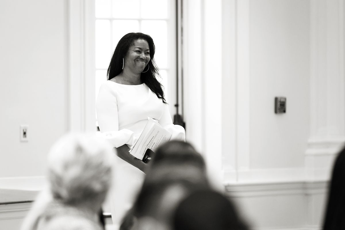 Kimberly G. Jackson speaking candidly before an audience, black and white